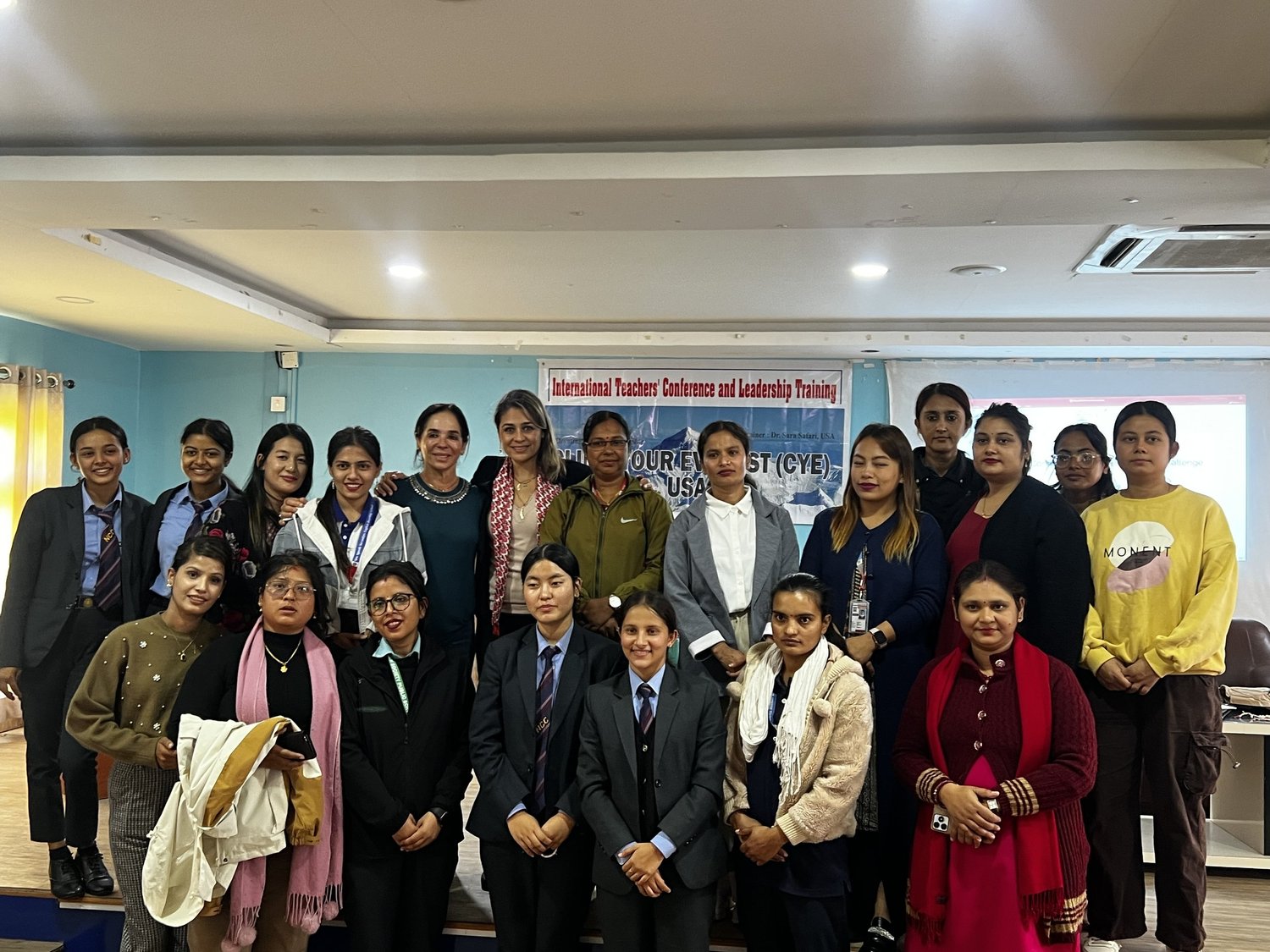Participants of the International Teachers’ Conference and Leadership Training standing together indoors